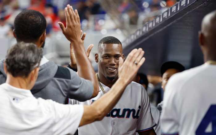Jorge Soler high fives his teammates.
